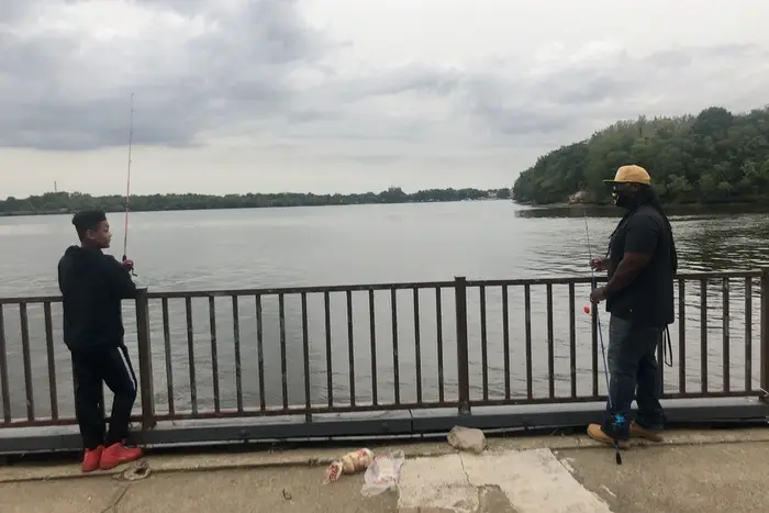 Jahsaun and Sam Barber fishing in the Delaware river.